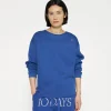 raw edge statement sweater