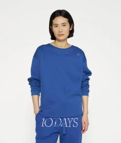 raw edge statement sweater